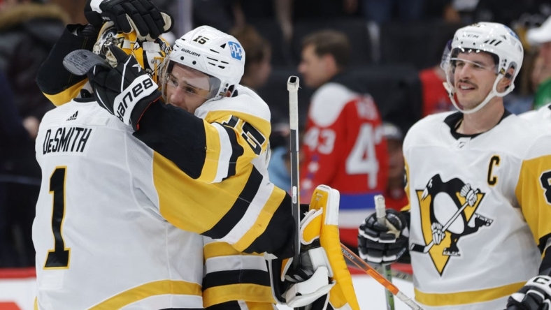 Nov 9, 2022; Washington, District of Columbia, USA; Pittsburgh Penguins goaltender Casey DeSmith (1) celebrates with Penguins right wing Josh Archibald (15) after their game against the Washington Capitals at Capital One Arena. Mandatory Credit: Geoff Burke-USA TODAY Sports