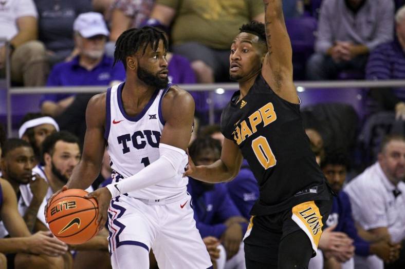 Nov 7, 2022; Fort Worth, Texas, USA; TCU Horned Frogs guard Mike Miles Jr. (1) and Arkansas-Pine Bluff Golden Lions guard Trejon Ware (0) in action during the game between the TCU Horned Frogs and the Arkansas-Pine Bluff Golden Lions at Ed and Rae Schollmaier Arena. Mandatory Credit: Jerome Miron-USA TODAY Sports