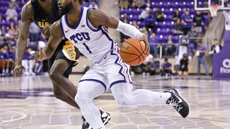 Nov 7, 2022; Fort Worth, Texas, USA; Arkansas-Pine Bluff Golden Lions guard Shaun Doss Jr. (21) and TCU Horned Frogs guard Mike Miles Jr. (1) in action during the game between the TCU Horned Frogs and the Arkansas-Pine Bluff Golden Lions at Ed and Rae Schollmaier Arena. Mandatory Credit: Jerome Miron-USA TODAY Sports