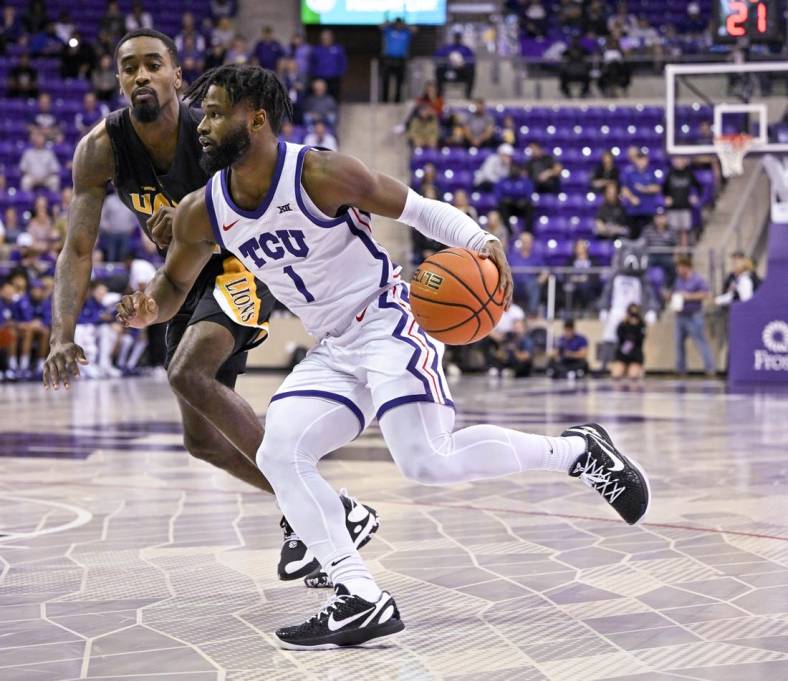 Nov 7, 2022; Fort Worth, Texas, USA; Arkansas-Pine Bluff Golden Lions guard Shaun Doss Jr. (21) and TCU Horned Frogs guard Mike Miles Jr. (1) in action during the game between the TCU Horned Frogs and the Arkansas-Pine Bluff Golden Lions at Ed and Rae Schollmaier Arena. Mandatory Credit: Jerome Miron-USA TODAY Sports