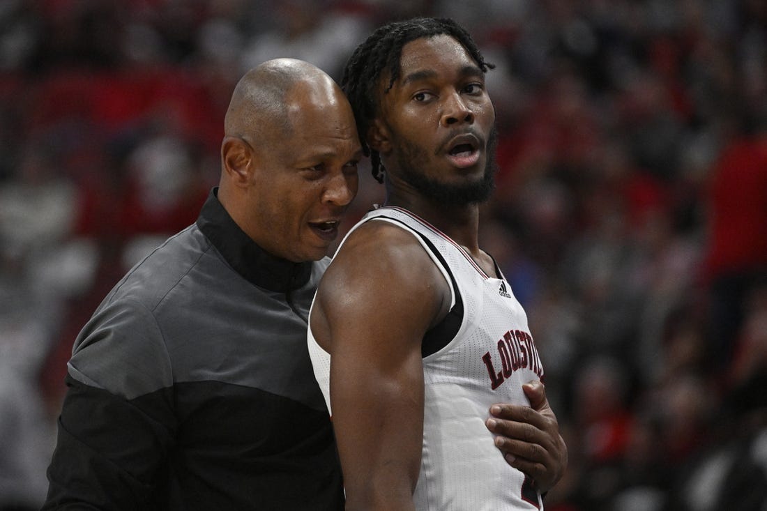 Nov 9, 2022; Louisville, Kentucky, USA;  Louisville Cardinals head coach Kenny Payne talks with forward Roosevelt Wheeler (4) during the second half against the Bellarmine Knights at KFC Yum! Center. Bellarmine defeated Louisville 67-66. Mandatory Credit: Jamie Rhodes-USA TODAY Sports