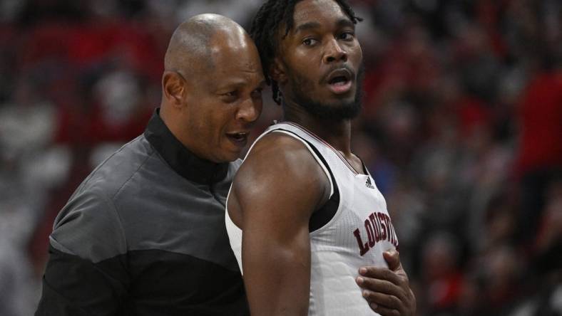 Nov 9, 2022; Louisville, Kentucky, USA;  Louisville Cardinals head coach Kenny Payne talks with forward Roosevelt Wheeler (4) during the second half against the Bellarmine Knights at KFC Yum! Center. Bellarmine defeated Louisville 67-66. Mandatory Credit: Jamie Rhodes-USA TODAY Sports