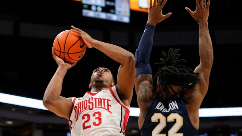 Nov 10, 2022; Columbus, OH, USA;  Ohio State Buckeyes guard Zed Key (23) shoots over Charleston Southern Buccaneers guard RJ Johnson (22) during the first half of the NCAA men's basketball game at Value City Arena. Mandatory Credit: Adam Cairns-The Columbus Dispatch

Charleston Southern At Ohio State Men S Basketball