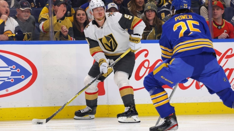 Nov 10, 2022; Buffalo, New York, USA;  Vegas Golden Knights center Jack Eichel (9) looks to make a pass as Buffalo Sabres defenseman Owen Power (25) defends during the first period at KeyBank Center. Mandatory Credit: Timothy T. Ludwig-USA TODAY Sports