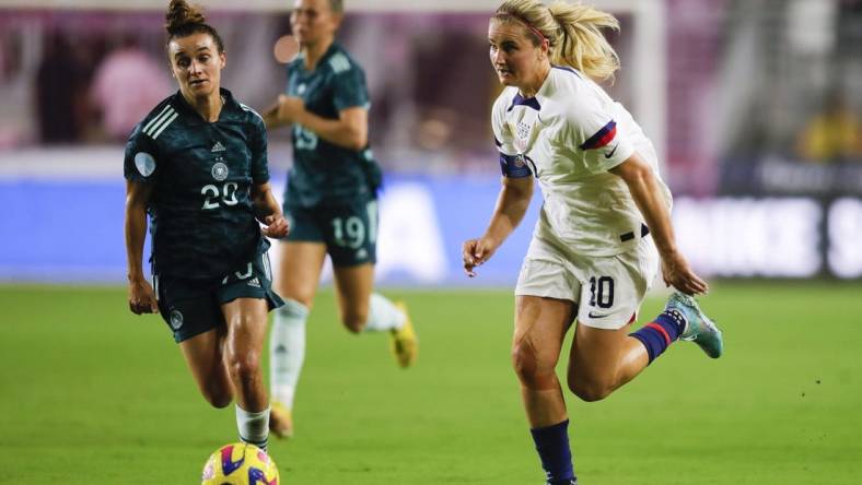 Nov 10, 2022; Ft. Lauderdale, Florida, USA; United States midfielder Lindsey Horan (10) runs with the ball ahead of Germany midfielder Lina Magull (20) during the first half at DRV PNK Stadium. Mandatory Credit: Sam Navarro-USA TODAY Sports