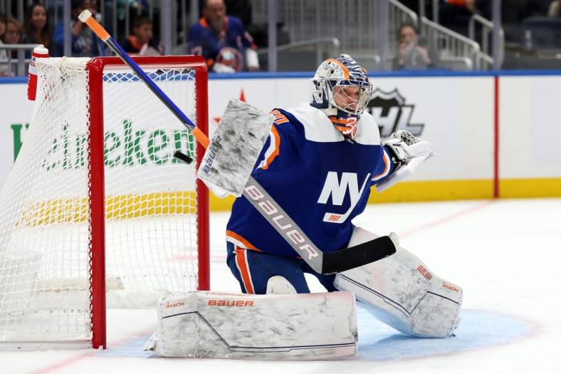 Nov 10, 2022; Elmont, New York, USA; New York Islanders goaltender Ilya Sorokin (30) makes a save against the Arizona Coyotes during the first period at UBS Arena. Mandatory Credit: Brad Penner-USA TODAY Sports