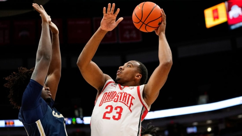 Nov 10, 2022; Columbus, OH, USA;  Ohio State Buckeyes guard Zed Key (23) shoots over Charleston Southern Buccaneers forward Taje' Kelly (14) during the first half of the NCAA men's basketball game at Value City Arena. Mandatory Credit: Adam Cairns-The Columbus Dispatch

Charleston Southern At Ohio State Men S Basketball