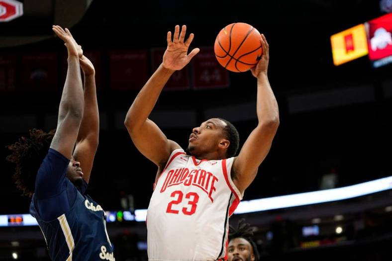 Nov 10, 2022; Columbus, OH, USA;  Ohio State Buckeyes guard Zed Key (23) shoots over Charleston Southern Buccaneers forward Taje' Kelly (14) during the first half of the NCAA men's basketball game at Value City Arena. Mandatory Credit: Adam Cairns-The Columbus Dispatch

Charleston Southern At Ohio State Men S Basketball