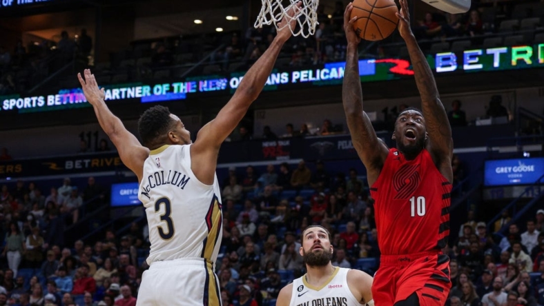 Nov 10, 2022; New Orleans, Louisiana, USA; Portland Trail Blazers forward Nassir Little (10) drives to the basket against New Orleans Pelicans guard CJ McCollum (3) during the first half at Smoothie King Center. Mandatory Credit: Stephen Lew-USA TODAY Sports
