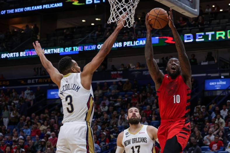 Nov 10, 2022; New Orleans, Louisiana, USA; Portland Trail Blazers forward Nassir Little (10) drives to the basket against New Orleans Pelicans guard CJ McCollum (3) during the first half at Smoothie King Center. Mandatory Credit: Stephen Lew-USA TODAY Sports
