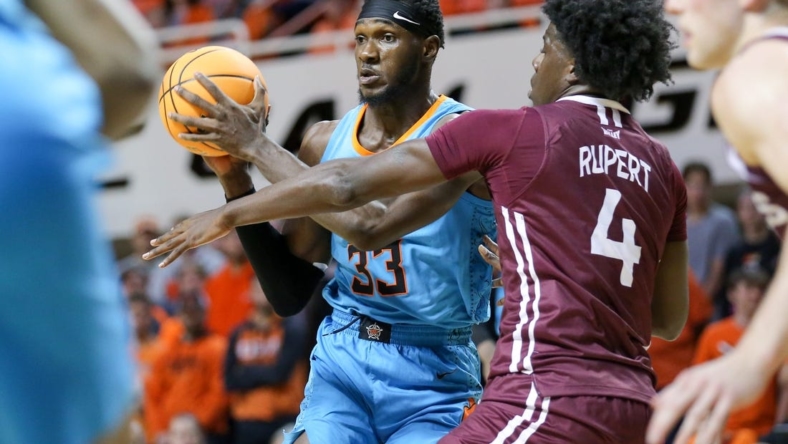 Oklahoma State forward Moussa Cisse (33) passes the ball in the second half during a college basketball game between the Oklahoma State Cowboys (OSU) and the Southern Illinois Salukis at Gallagher-Iba Arena in Stillwater, Okla., Thursday, Nov. 10, 2022.

Osu Vs Southern Illinois