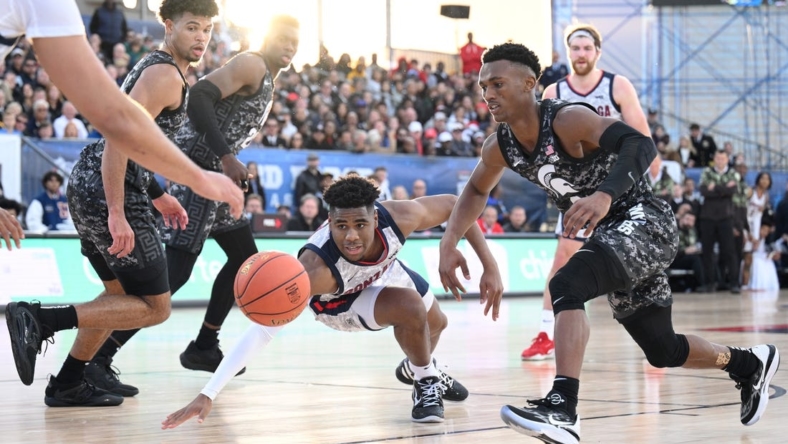 Nov 11, 2022; San Diego, California, US; Gonzaga Bulldogs guard Malachi Smith (13) dives for a loose ball during the first half against the Michigan State Spartans at USS Abraham Lincoln. Mandatory Credit: Orlando Ramirez-USA TODAY Sports