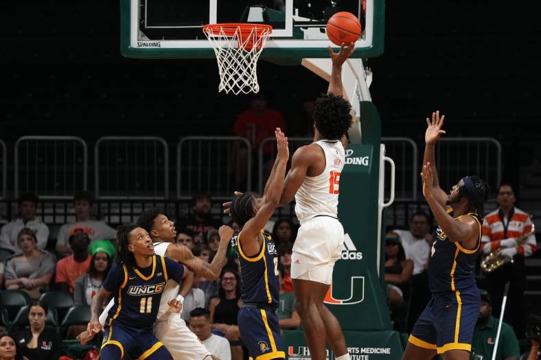 Nov 11, 2022; Coral Gables, Florida, USA; Miami Hurricanes forward Norchad Omier (15) shoots the ball against the UNC Greensboro Spartans during the first half at Watsco Center. Mandatory Credit: Jasen Vinlove-USA TODAY Sports