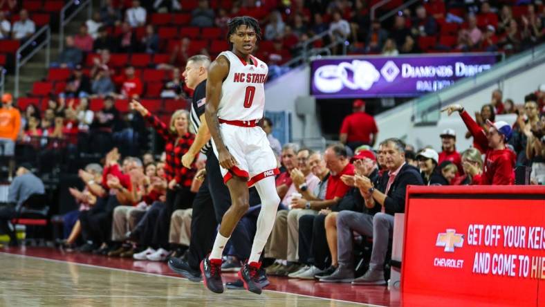 Nov 11, 2022; Raleigh, North Carolina, USA; North Carolina State Wolfpack guard Terquavion Smith (0) celebrates a point during the first half against Campbell Fighting Camels at PNC Arena. Mandatory Credit: Jaylynn Nash-USA TODAY Sports