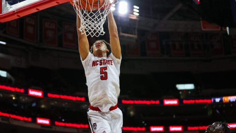 Nov 11, 2022; Raleigh, North Carolina, USA; North Carolina State Wolfpack guard Jack Clark (5) dunks during the first half against Campbell Fighting Camels at PNC Arena. Mandatory Credit: Jaylynn Nash-USA TODAY Sports