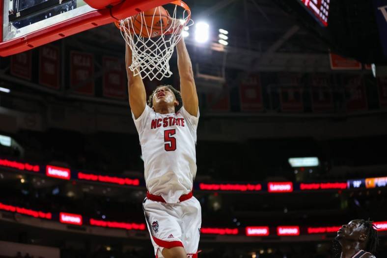 Nov 11, 2022; Raleigh, North Carolina, USA; North Carolina State Wolfpack guard Jack Clark (5) dunks during the first half against Campbell Fighting Camels at PNC Arena. Mandatory Credit: Jaylynn Nash-USA TODAY Sports
