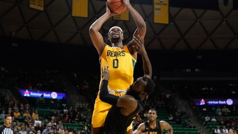 Nov 11, 2022; Waco, Texas, USA;  Baylor Bears forward Flo Thamba (0) scores a basket while being fouled by Norfolk State Spartans guard Joe Bryant Jr. (4) during the first half at Ferrell Center. Mandatory Credit: Chris Jones-USA TODAY Sports