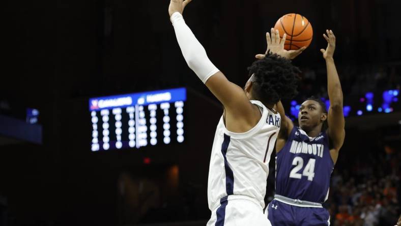 Nov 11, 2022; Charlottesville, Virginia, USA; Monmouth Hawks guard Myles Ruth (24) shoots the ball as Virginia Cavaliers forward Jayden Gardner (1) defends in the first half at John Paul Jones Arena. Mandatory Credit: Geoff Burke-USA TODAY Sports