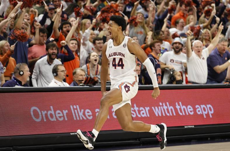 Nov 11, 2022; Auburn, Alabama, USA;  Auburn Tigers center Dylan Cardwell (44) celebrates along the student section after blocking a South Florida Bulls shot during the second half at Neville Arena. Mandatory Credit: John Reed-USA TODAY Sports