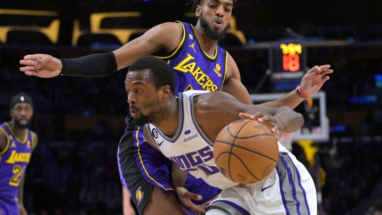 Nov 11, 2022; Los Angeles, California, USA;  Los Angeles Lakers forward Troy Brown Jr. (7) guards Sacramento Kings forward Harrison Barnes (40) as he drives to the basket in the first half at Crypto.com Arena. Mandatory Credit: Jayne Kamin-Oncea-USA TODAY Sports