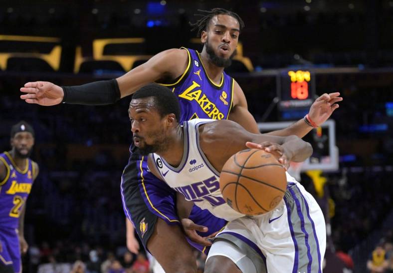 Nov 11, 2022; Los Angeles, California, USA;  Los Angeles Lakers forward Troy Brown Jr. (7) guards Sacramento Kings forward Harrison Barnes (40) as he drives to the basket in the first half at Crypto.com Arena. Mandatory Credit: Jayne Kamin-Oncea-USA TODAY Sports