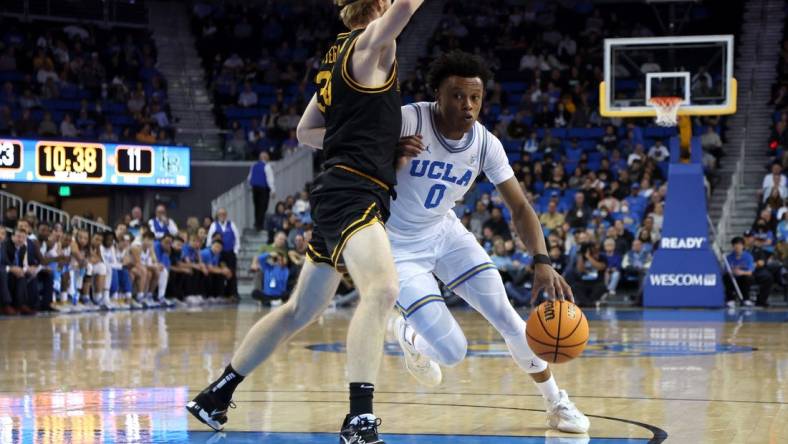 Nov 11, 2022; Los Angeles, California, USA;  UCLA Bruins guard Jaylen Clark (0) drives to the basket during the first half against the Long Beach State Beach at Pauley Pavilion presented by Wescom. Mandatory Credit: Kiyoshi Mio-USA TODAY Sports