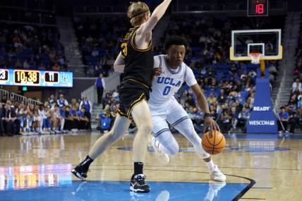 Nov 11, 2022; Los Angeles, California, USA;  UCLA Bruins guard Jaylen Clark (0) drives to the basket during the first half against the Long Beach State Beach at Pauley Pavilion presented by Wescom. Mandatory Credit: Kiyoshi Mio-USA TODAY Sports
