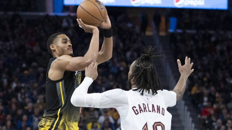 November 11, 2022; San Francisco, California, USA; Golden State Warriors guard Jordan Poole (3) shoots the basketball against Cleveland Cavaliers guard Darius Garland (10) during the third quarter at Chase Center. Mandatory Credit: Kyle Terada-USA TODAY Sports