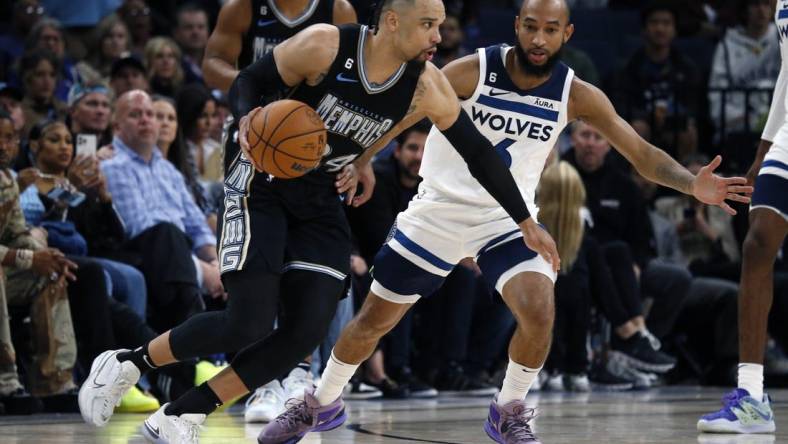 Nov 11, 2022; Memphis, Tennessee, USA; Memphis Grizzlies forward Dillon Brooks (24) dribbles as Minnesota Timberwolves guard Jordan McLaughlin (6) defends during the second half at FedExForum. Mandatory Credit: Petre Thomas-USA TODAY Sports