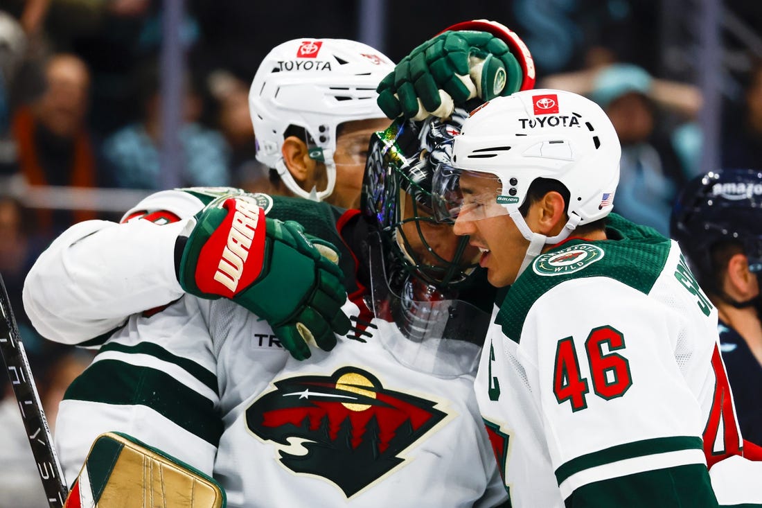 Nov 11, 2022; Seattle, Washington, USA; Minnesota Wild goaltender Marc-Andre Fleury (29) and defenseman Jared Spurgeon (46) celebrate following a 1-0 victory against the Seattle Kraken at Climate Pledge Arena. Mandatory Credit: Joe Nicholson-USA TODAY Sports