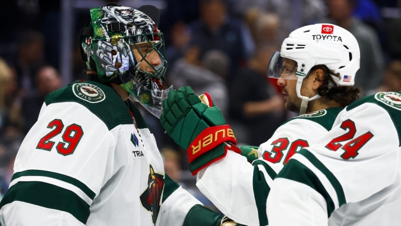 Nov 11, 2022; Seattle, Washington, USA; Minnesota Wild goaltender Marc-Andre Fleury (29) and right wing Mats Zuccarello (36) celebrate following a 1-0 victory against the Seattle Kraken at Climate Pledge Arena. Mandatory Credit: Joe Nicholson-USA TODAY Sports