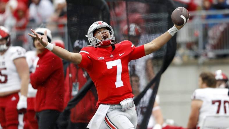 Nov 12, 2022; Columbus, Ohio, USA;  Ohio State Buckeyes quarterback C.J. Stroud (7) runs for the first down during the third quarter against the Indiana Hoosiers at Ohio Stadium. Mandatory Credit: Joseph Maiorana-USA TODAY Sports