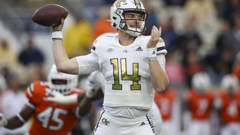 Nov 12, 2022; Atlanta, Georgia, USA; Georgia Tech Yellow Jackets quarterback Zach Pyron (14) throws a pass against the Miami Hurricanes in the first quarter at Bobby Dodd Stadium. Mandatory Credit: Brett Davis-USA TODAY Sports