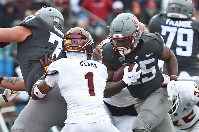 Nov 12, 2022; Pullman, Washington, USA; Washington State Cougars running back Nakia Watson (25) carries the ball n for a score against Arizona State Sun Devils defensive back Jordan Clark (1) in the first half at Gesa Field at Martin Stadium. Mandatory Credit: James Snook-USA TODAY Sports