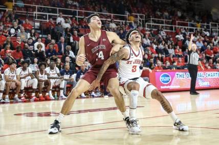 Nov 15, 2022; Queens, New York, USA;  Lafayette Leopards forward Kyle Jenkins (14) and St. John's Red Storm guard Andre Curbelo (3) battle for a rebound in the first half at Carnesecca Arena. Mandatory Credit: Wendell Cruz-USA TODAY Sports