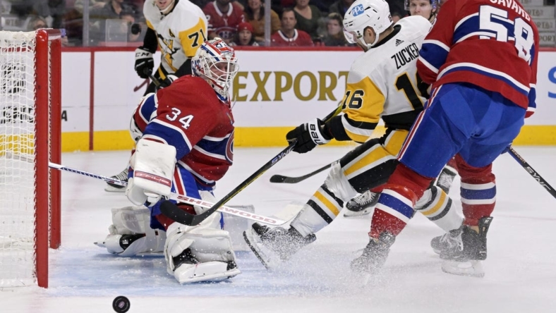 Nov 12, 2022; Montreal, Quebec, CAN; Montreal Canadiens goalie Jake Allen (34) defends against Pittsburgh Penguins forward Jason Zucker (16) with the help of teammate defenseman David Savard (58) during the first period at the Bell Centre. Mandatory Credit: Eric Bolte-USA TODAY Sports
