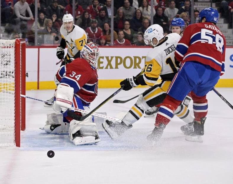 Nov 12, 2022; Montreal, Quebec, CAN; Montreal Canadiens goalie Jake Allen (34) defends against Pittsburgh Penguins forward Jason Zucker (16) with the help of teammate defenseman David Savard (58) during the first period at the Bell Centre. Mandatory Credit: Eric Bolte-USA TODAY Sports