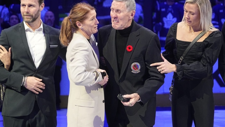Nov 12, 2022; Toronto, Ontario, CAN; Toronto Maple Leafs alumni and Hall of Famer Borje Salming and his wife Pia have an emotional moment before a game between the Vancouver Canucks and Toronto Maple Leafs at Scotiabank Arena. Mandatory Credit: John E. Sokolowski-USA TODAY Sports
