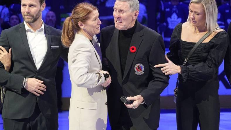 Nov 12, 2022; Toronto, Ontario, CAN; Toronto Maple Leafs alumni and Hall of Famer Borje Salming and his wife Pia have an emotional moment before a game between the Vancouver Canucks and Toronto Maple Leafs at Scotiabank Arena. Mandatory Credit: John E. Sokolowski-USA TODAY Sports