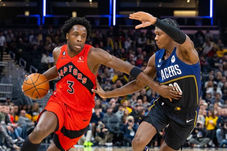 Nov 12, 2022; Indianapolis, Indiana, USA; Toronto Raptors forward O.G. Anunoby (3) dribbles the ball while Indiana Pacers guard Bennedict Mathurin (00) defends in the second quarter at Gainbridge Fieldhouse. Mandatory Credit: Trevor Ruszkowski-USA TODAY Sports
