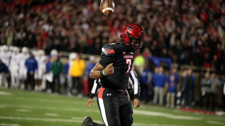 Nov 12, 2022; Lubbock, Texas, USA;  Texas Tech Red Raiders quarterback Donovan Smith (7) reacts after scoring a touchdown against the Kansas Jayhawks in the second half at Jones AT&T Stadium and Cody Campbell Field. Mandatory Credit: Michael C. Johnson-USA TODAY Sports