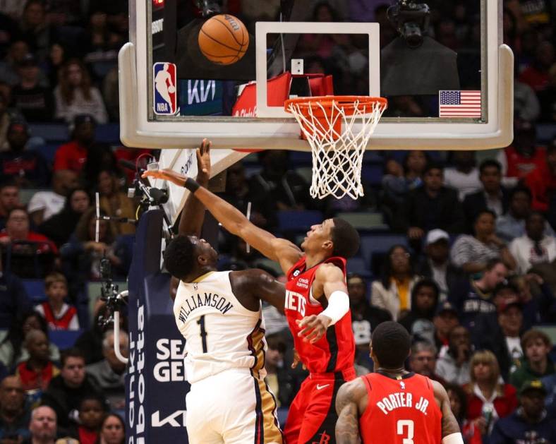 Nov 12, 2022; New Orleans, Louisiana, USA;  New Orleans Pelicans forward Zion Williamson (1) shoots over Houston Rockets forward Jabari Smith Jr. (1) during the first half at Smoothie King Center. Mandatory Credit: Stephen Lew-USA TODAY Sports