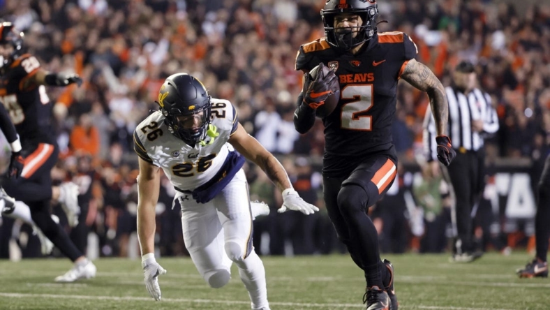 Nov 12, 2022; Corvallis, Oregon, USA; Oregon State Beavers wide receiver Anthony Gould (2) runs the ball for a touchdown during the first half against the California Golden Bears at Reser Stadium. Mandatory Credit: Soobum Im-USA TODAY Sports