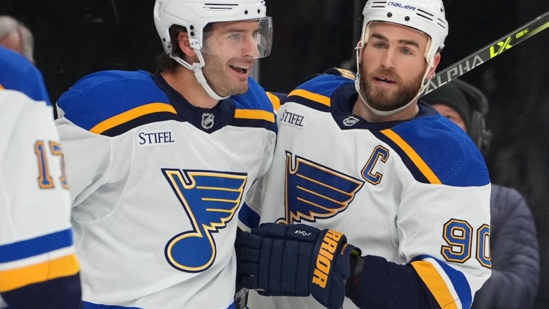 Nov 12, 2022; Las Vegas, Nevada, USA; St. Louis Blues left wing Brandon Saad (20) celebrates with St. Louis Blues center Ryan O'Reilly (90) after scoring against the Vegas Golden Knights during the first period at T-Mobile Arena. Mandatory Credit: Stephen R. Sylvanie-USA TODAY Sports