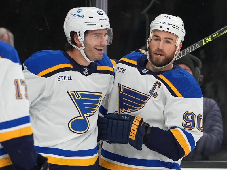 Nov 12, 2022; Las Vegas, Nevada, USA; St. Louis Blues left wing Brandon Saad (20) celebrates with St. Louis Blues center Ryan O'Reilly (90) after scoring against the Vegas Golden Knights during the first period at T-Mobile Arena. Mandatory Credit: Stephen R. Sylvanie-USA TODAY Sports