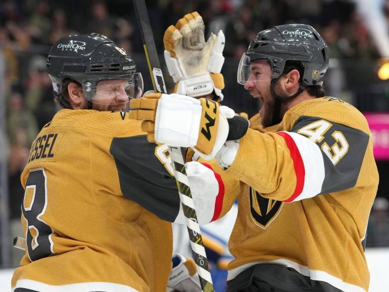Nov 12, 2022; Las Vegas, Nevada, USA; Vegas Golden Knights center Phil Kessel (8) celebrates with Vegas Golden Knights center Paul Cotter (43) after scoring a goal against the St. Louis Blues during the second period at T-Mobile Arena. Mandatory Credit: Stephen R. Sylvanie-USA TODAY Sports