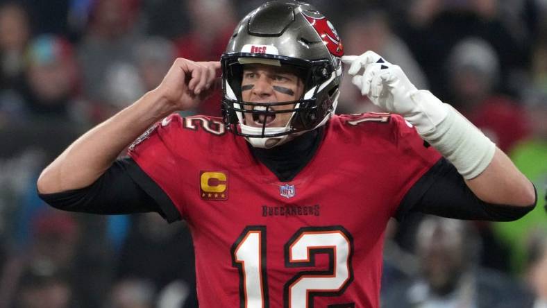 Nov 13, 2022; Munich, Germany; Tampa Bay Buccaneers quarterback Tom Brady (12) gestures in the fourth quarter against the Seattle Seahawks during an NFL International Series game at Allianz Arena. Mandatory Credit: Kirby Lee-USA TODAY Sports