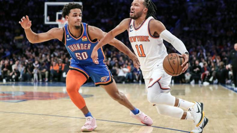 Nov 13, 2022; New York, New York, USA; New York Knicks guard Jalen Brunson (11) drives past Oklahoma City Thunder forward Jeremiah Robinson-Earl (50) in the first half at Madison Square Garden. Mandatory Credit: Wendell Cruz-USA TODAY Sports