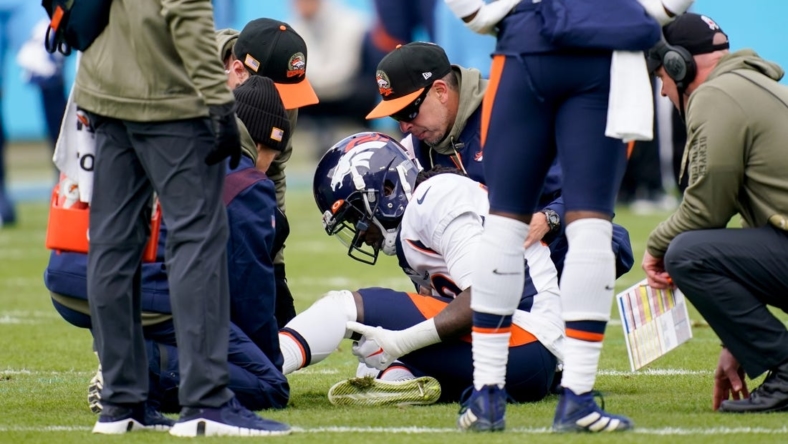 Nov 13, 2022; Nashville, Tennessee, USA; Denver Broncos wide receiver Jerry Jeudy (10) is checked by trainers after getting injured in the first quarter at Nissan Stadium. Mandatory Credit: Andrew Nelles-USA TODAY Sports