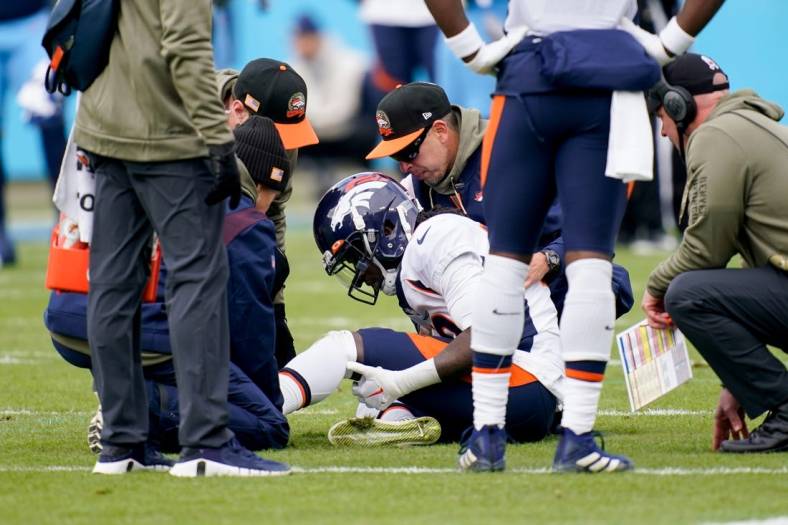Nov 13, 2022; Nashville, Tennessee, USA; Denver Broncos wide receiver Jerry Jeudy (10) is checked by trainers after getting injured in the first quarter at Nissan Stadium. Mandatory Credit: Andrew Nelles-USA TODAY Sports